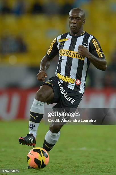 Seedorf of Botafogo drives the ball during the match between Flamengo and Botafogo as part of the Brazilian Serie A championship at the Maracana...