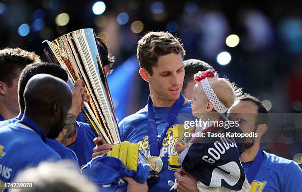 Clarence Goodson of the USA celebrates with his daughter after a win over Panama during the CONCACAF Gold Cup final match at Soldier Field on July...