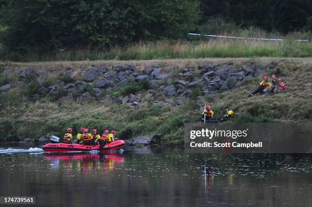 Police and Tayside Fire and Rescue Services search the River Tay after a 16 year-old boy was reported missing on July 28, 2013 in Perth, Scotland....