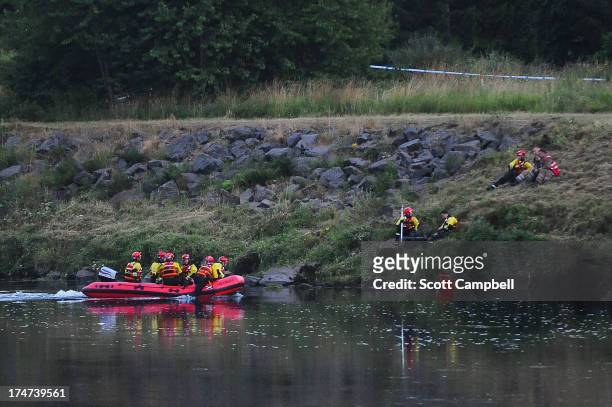 Police and Tayside Fire and Rescue Services search the River Tay after a 16 year-old boy was reported missing on July 28, 2013 in Perth, Scotland....
