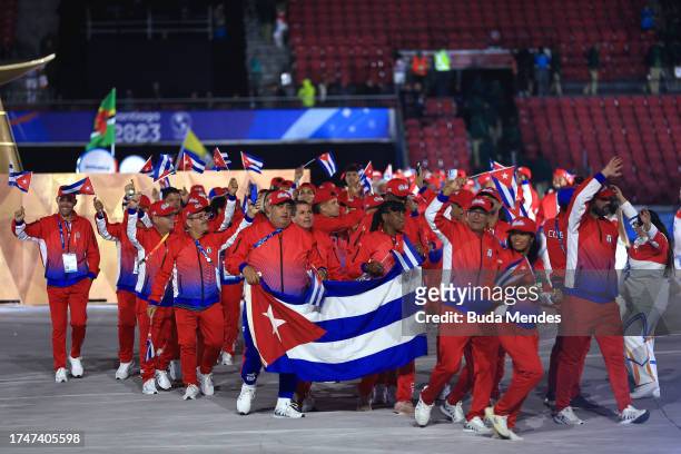 Flag bearers of Cuba Julio Cesar La Cruz and Idalys Ortiz lead their delegation during the opening ceremony of the Santiago 2023 Pan Am Games at...