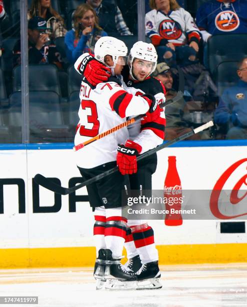 Tyler Toffoli of the New Jersey Devils celebrates his second period powerplay goal against the New York Islanders and is joined by Jack Hughes at UBS...