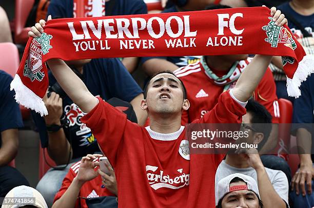 Liverpool fan sings "You'll Never Walk Alone" during the international friendly match between Thailand and Liverpool at the Rajamangala Stadium on...