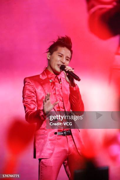 South Korean singer Kim Junsu of JYJ performs on the stage in concert at Mercedes Benz Arena on July 28, 2013 in Shanghai, China.
