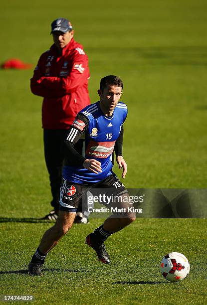 Terry McFlynn controls the ball as Sydney FC coach Frank Farina looks on during a Sydney FC A-League training session at Macquarie Uni on July 29,...