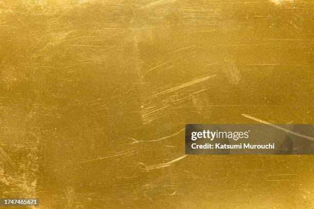 scratched metalic gold background - gold plate stock pictures, royalty-free photos & images