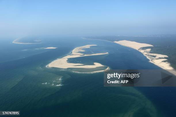 An aerial photo taken on July 26, 2013 shows the Bench of Arguin in the Arcachon Basin on the French southwestern Atlantic Coast. In the background,...