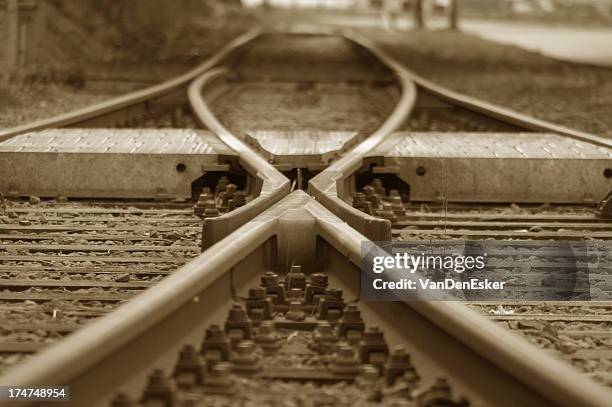 the joining of two railroads tracks into one - railroad track stock pictures, royalty-free photos & images