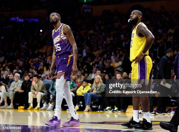 Kevin Durant of the Phoenix Suns and LeBron James of the Los Angeles Lakers look at a foul shot during the first half at Crypto.com Arena on October...