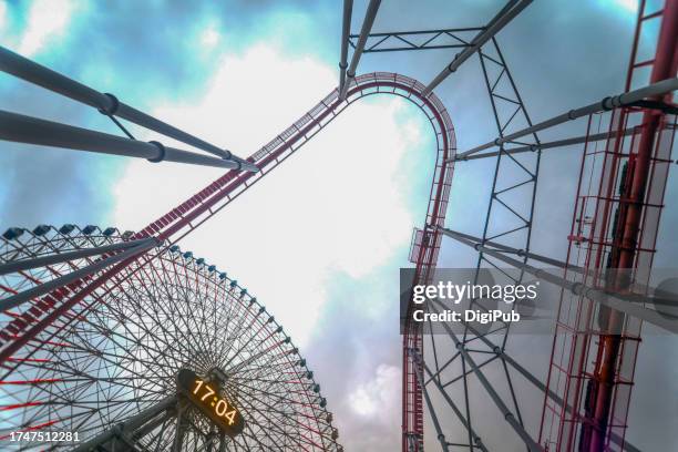 ferris wheel and roller coaster - biggest stock pictures, royalty-free photos & images