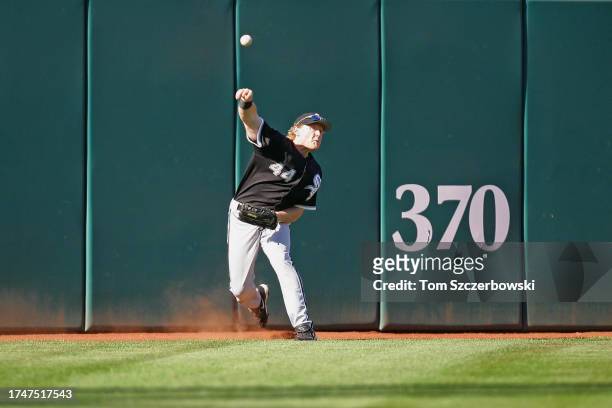 Brian Anderson of the Chicago White Sox fields a double off the wall and throws it back to the infield on a hit by Travis Hafner of the Cleveland...