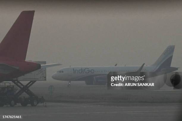 An IndiGo aircraft prepares to take off during heavy air pollution at Indira Gandhi International Airport in New Delhi on October 27, 2023.