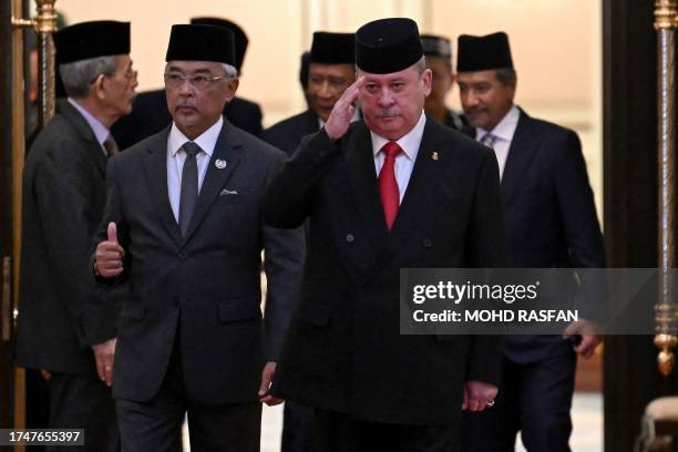 Malaysia's King Sultan Abdullah Sultan Ahmad Shah and Sultan Ibrahim Iskandar of Johor walk together after the election for the next Malaysian king...