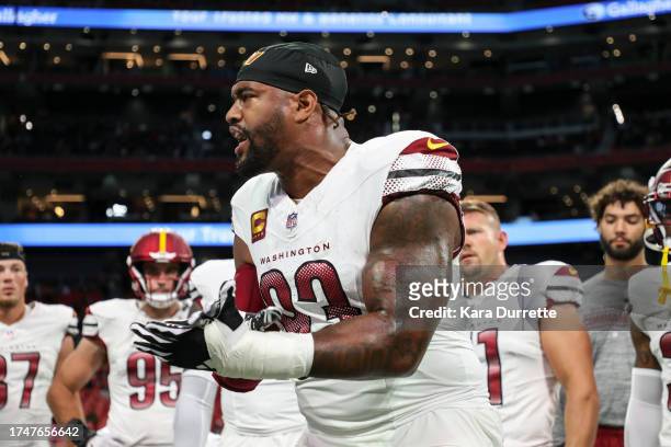 Jonathan Allen of the Washington Commanders leads a huddle prior to an NFL football game against the Atlanta Falcons at Mercedes-Benz Stadium on...