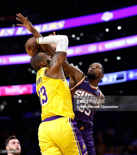 Kevin Durant of the Phoenix Suns fouls LeBron James of the Los Angeles Lakers during the second half at Crypto.com Arena on October 26, 2023 in Los...