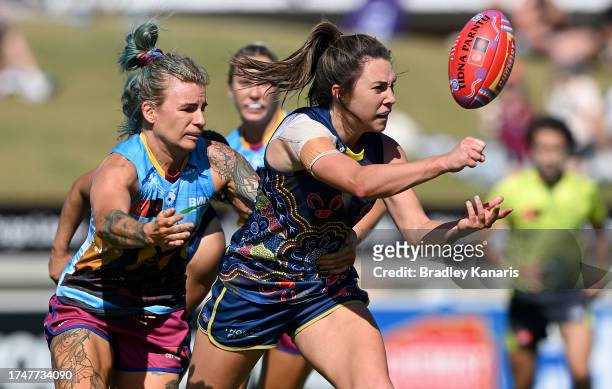 Niamh Kelly of the Crows gets a handball away during the round eight AFLW match between Brisbane Lions and Adelaide Crows at Brighton Homes Arena, on...
