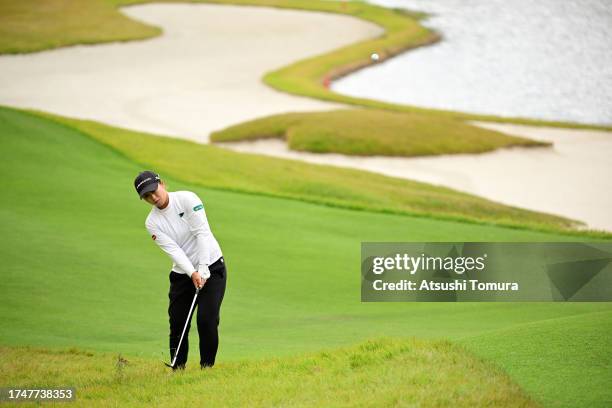 Mao Saigo of Japan chips onto the 15th green during the third round of NOBUTA Group Masters GC Ladies at Masters Golf Club on October 21, 2023 in...