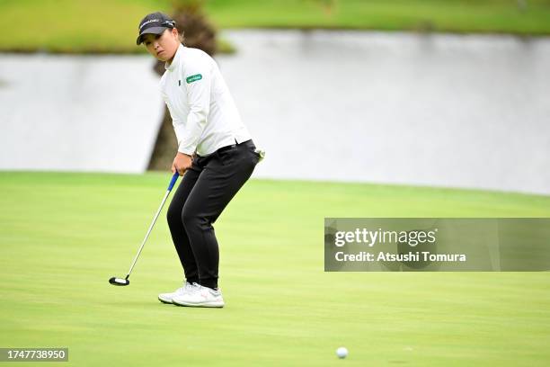 Mao Saigo of Japan attempts a putt on the 15th green during the third round of NOBUTA Group Masters GC Ladies at Masters Golf Club on October 21,...