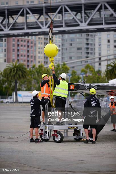 Emirates Team New Zealand base early in the morning launching their race boat and placing the wing on the boat. The Louis Vuitton Cup sailed in AC...