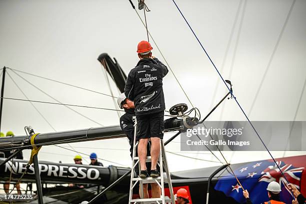 Emirates Team New Zealand base early in the morning launching their race boat and placing the wing on the boat. The Louis Vuitton Cup sailed in AC...