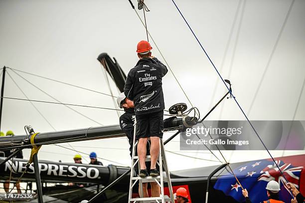 Emirates Team New Zealand base early in the morning launching their race boat and placing the wing on the boat. The Louis Vuitton Cup sailed in AC...