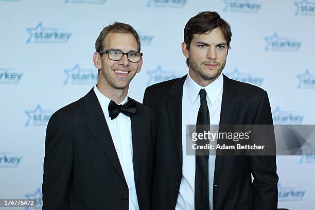 Michael Kutcher and brother Ashton Kutcher walk the red carpet before the 2013 Starkey Hearing Foundation's "So the World May Hear" Awards Gala on...