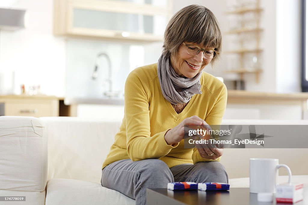 Senior Woman taking medicine