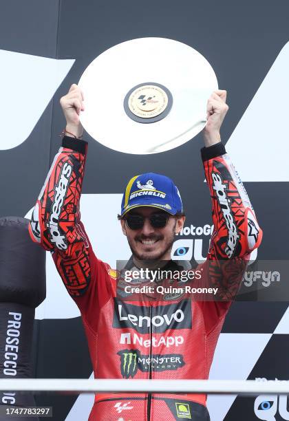 Francesco Bagnaia of Italy and the Ducati Lenovo Team celebrate on the podium after finishing second in the 2023 MotoGP of Australia at Phillip...