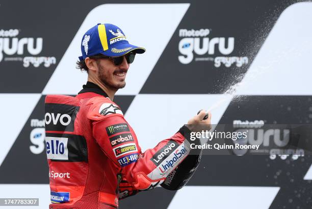 Francesco Bagnaia of Italy and the Ducati Lenovo Team celebrate on the podium after finishing second in the 2023 MotoGP of Australia at Phillip...