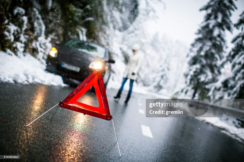Car breakdown on the snowy rural road