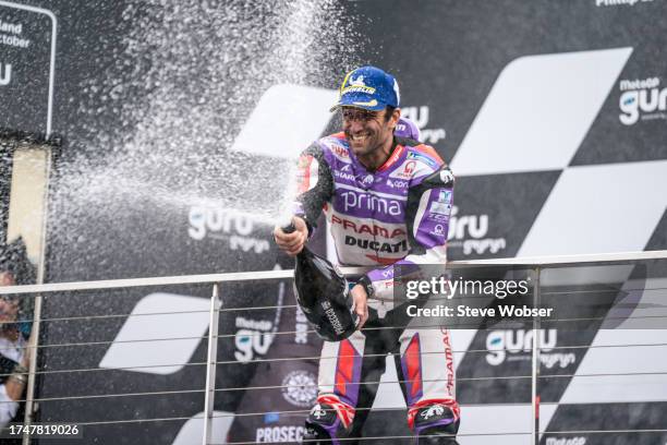 Johann Zarco of France and Prima Pramac Racing celebrates his first MotoGP win with Prosecco during race ahead of the 2023 MotoGP of Australia at...