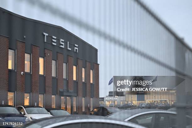 Photograph taken on October 27, 2023 shows a view of the electric car company Tesla's Service Center in Segeltorp, south of Stockholm, where workers...