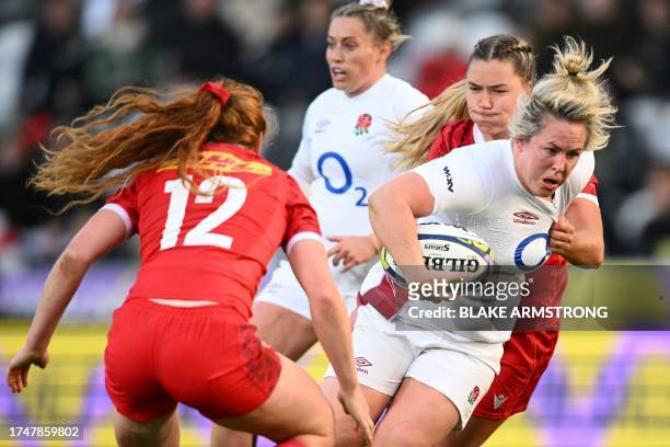 England's Marlie Packer breaks through a tackle during the WXV 1 women's rugby match between England and Canada at Forsyth Barr Stadium in Dunedin on...