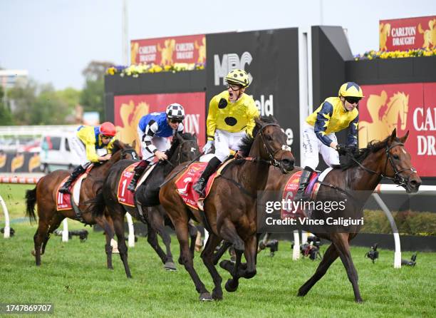 Mark Zahra riding Without A Fight defeats Jamie Spencer riding West Wind Blows in Race 9, the Carlton Draught Caulfield Cup, during Melbourne Racing...