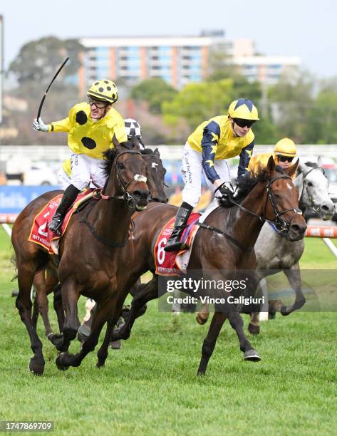 Mark Zahra riding Without A Fight defeats Jamie Spencer riding West Wind Blows in Race 9, the Carlton Draught Caulfield Cup, during Melbourne Racing...