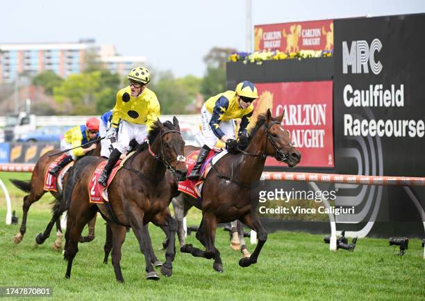Mark Zahra riding Without A Fight defeats Jamie Spencer riding West Wind Blows in Race 9, the Carlton Draught Caulfield Cup, during Melbourne Racing...