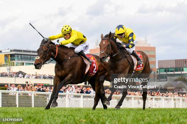 Mark Zahra riding Without A Fight defeats Jamie Spencer riding West Wind Blows in Race 9, the Carlton Draught Caulfield Cup, during Melbourne Racing...