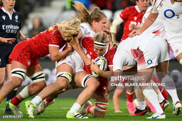 Canada's Courtney Holtkamp attempts to break through a tackle during the WXV 1 women's rugby match between England and Canada at Forsyth Barr Stadium...