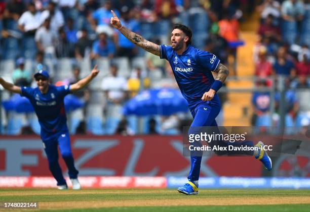 Reece Topley of England celebrates the wicket of Quinton de Kock of South Africa during the ICC Men's Cricket World Cup India 2023 match between...