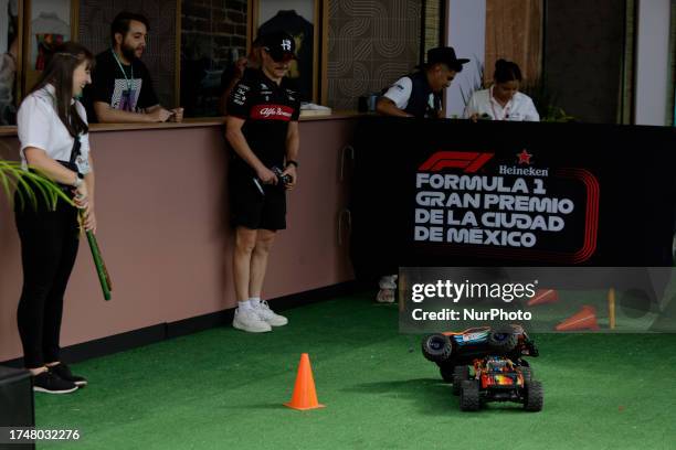 Valtteri Bottas, driver of the Alfa Romeo Team, drives a remote control car during activities prior to the first practice, qualifying and Grand Prix...