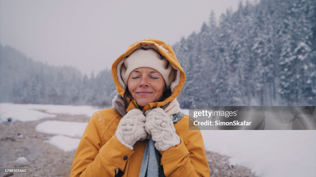 Happy woman enjoying winter time