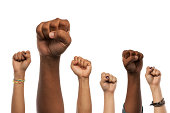 Fists and Arms raised in unison against white