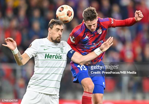 Sebastian Coates of Sporting CP and Ante Crnac of Rakow Czestochowa compete for the ball during UEFA Europa League match between Rakow Czestochowa...