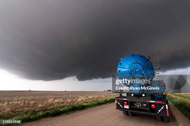 Doppler radar truck with the Center for Severe Weather Research scans a developing supercell thunderstorm near Hays, Kansas, May 25, 2012. These...