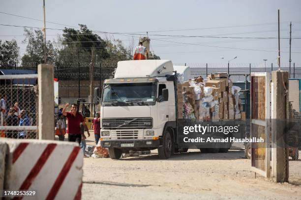 The entry of humanitarian aid arrives through the Rafah land crossing into the Gaza Strip on October 21, 2023 in Rafah, Gaza. Two weeks after a...