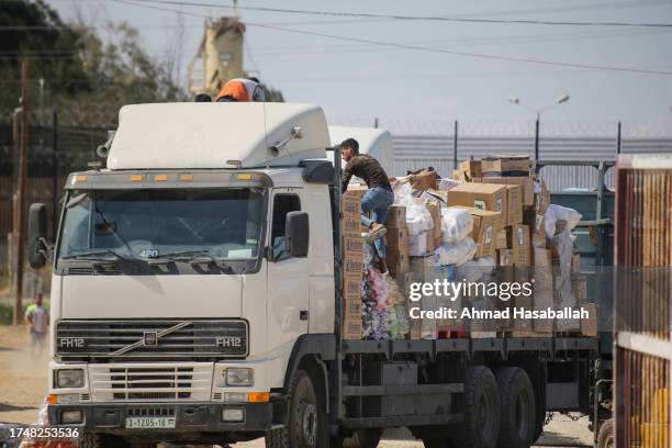 The entry of humanitarian aid arrives through the Rafah land crossing into the Gaza Strip on October 21, 2023 in Rafah, Gaza. Two weeks after a...