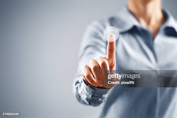 businesswoman pressing button on touch screen - finger bildbanksfoton och bilder