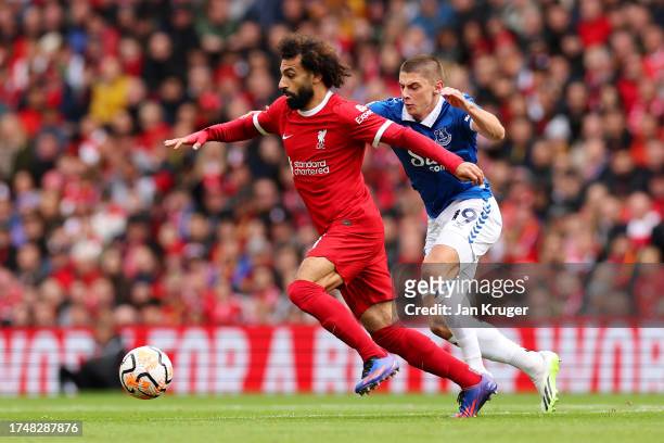 Mohamed Salah of Liverpool is put under pressure by Vitaliy Mykolenko of Everton during the Premier League match between Liverpool FC and Everton FC...