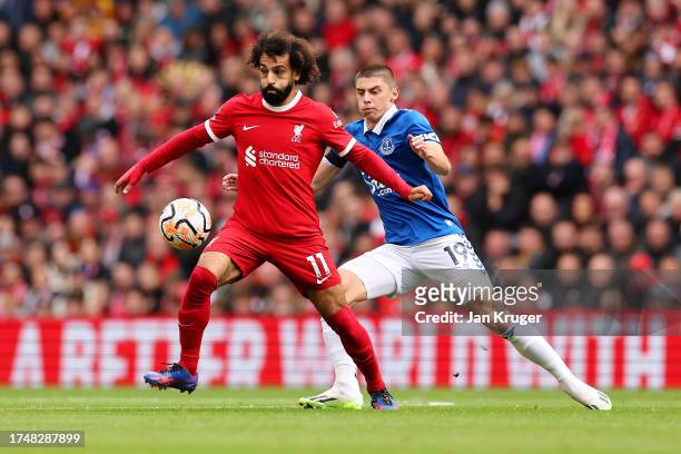 Mohamed Salah of Liverpool is put under pressure by Vitaliy Mykolenko of Everton during the Premier League match between Liverpool FC and Everton FC...