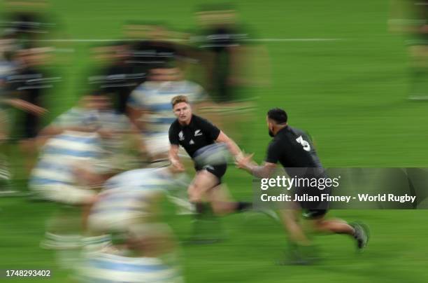 Jordie Barrett of New Zealand passes the ball during the Rugby World Cup France 2023 semi-final match between Argentina and New Zealand at Stade de...